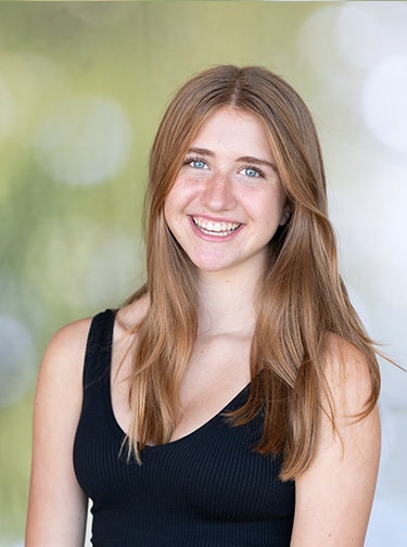 young, blonde woman in a black tank top