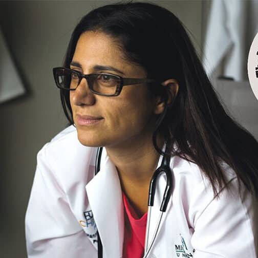 Seated female doctor wearing a lab coat