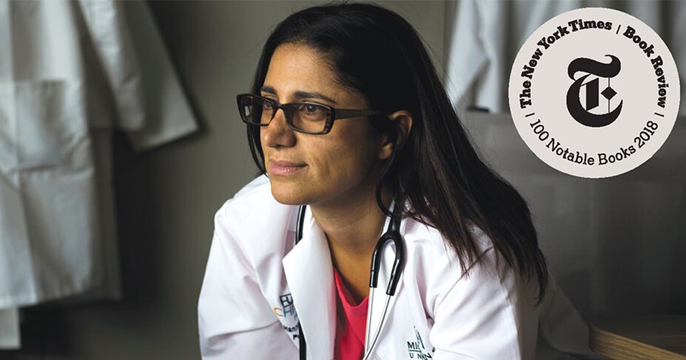 Seated female doctor wearing a lab coat
