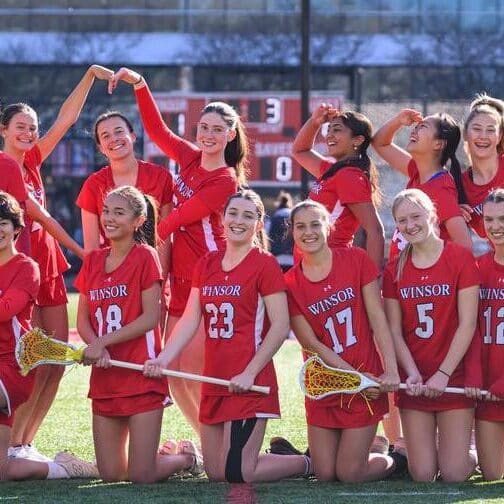 Lacrosse team poses in two lines