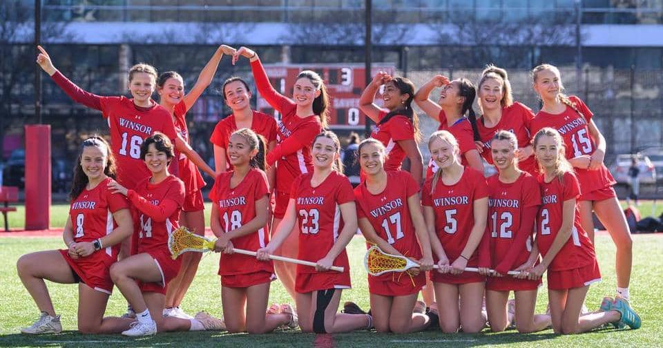 Lacrosse team poses in two lines