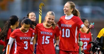 Winsor field hockey players celebrate together