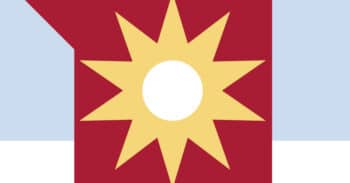 graphic of a yellow sun with a white center on a red square