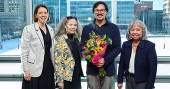 chris player posing for picture with Bondoc sisters and Meredith Legg
