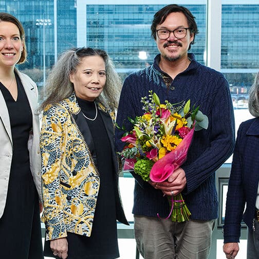 chris player posing for picture with Bondoc sisters and Meredith Legg