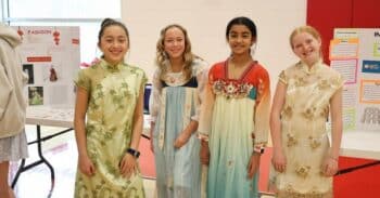 four girls in historical greek, roman, and chinese outfits