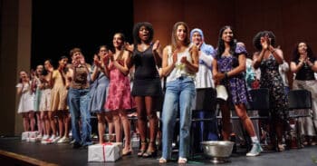 seniors on stage cheering